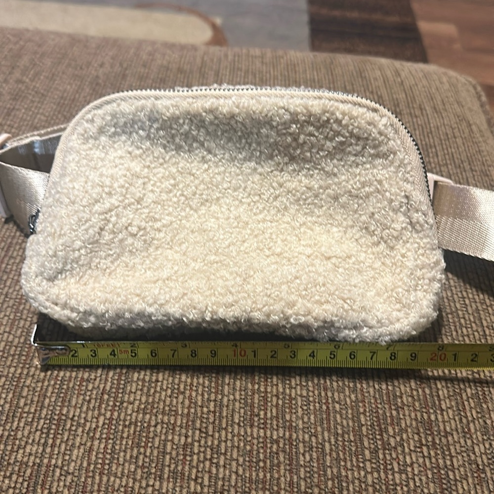Fleece belt bag. New without tags tan color.
